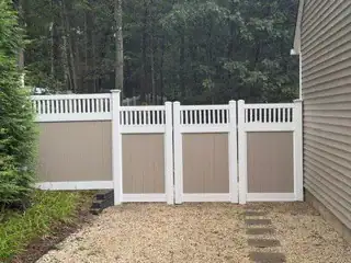 Tall white and brown privacy fence installed in Suffolk County, New York
